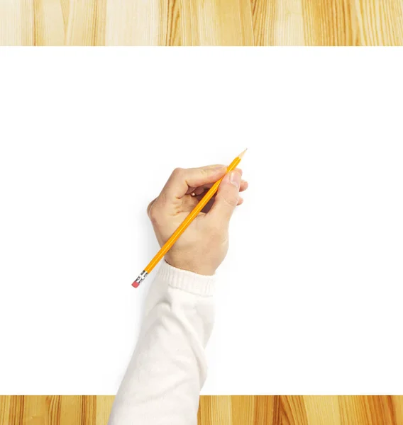 Mão do homem escrevendo sobre o livro branco na mesa de madeira — Fotografia de Stock