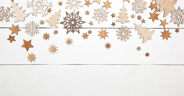 Krásné vánoční pozadí se spoustou malých dřevěných de — Stock fotografie
