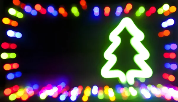 Der schöne verschwommene weihnachtliche Hintergrund mit vielen Lichtern — Stockfoto
