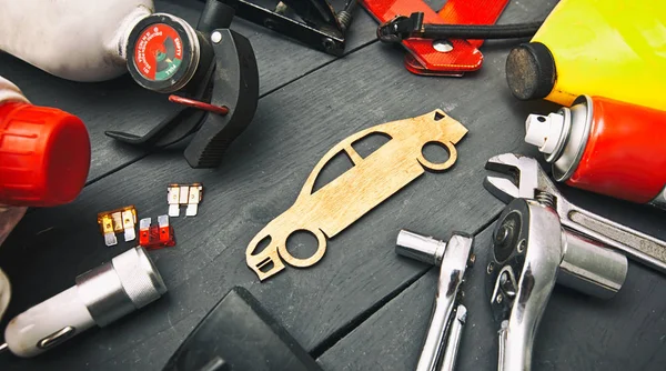 A lot of different car accessories and equipment on the wooden t — Stock Photo, Image