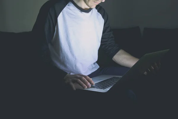 Young Man Sitting Sofa Modern Laptop Evening Surfing Web — Stock Photo, Image