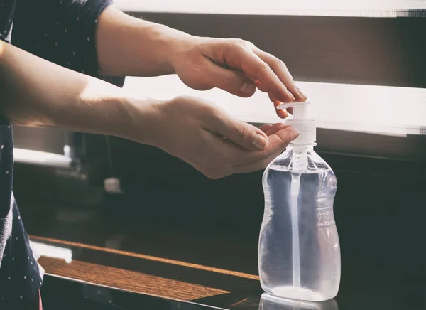 Woman Applying Sanitizer Her Hand Home — Stock Photo, Image