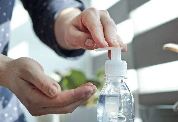 Woman Applying Sanitizer Her Hand Home — Stock Photo, Image