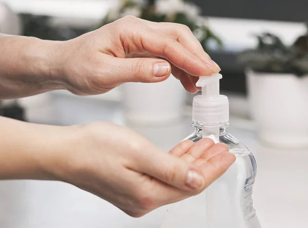 Woman Applying Sanitizer Her Hand Home — Stock Photo, Image