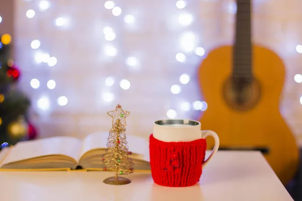 Christmas background with guitar.Still life in the home interior — Stock Photo, Image