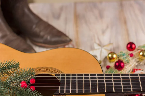 Christmas music background with acoustic guitar and holiday deco — Stock Photo, Image