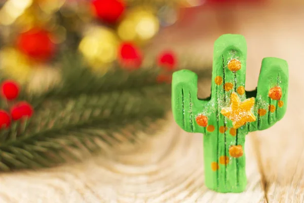 Green cactus toy on christmas background for text — Stock Photo, Image