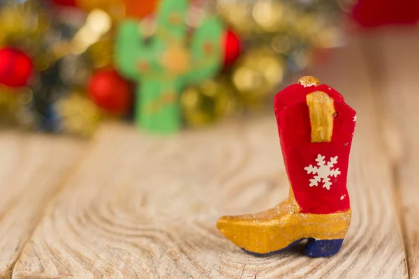 Cowboy boot on christmas wood background — Stock Photo, Image