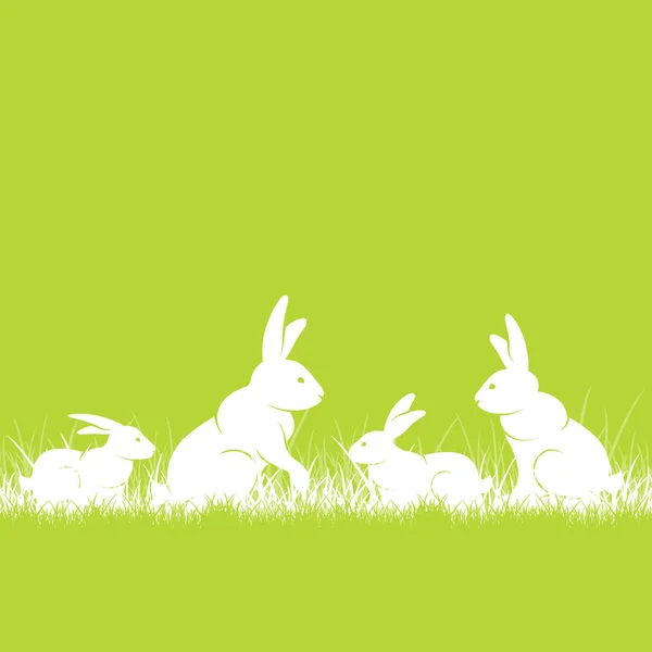Кролики в траве — стоковый вектор
