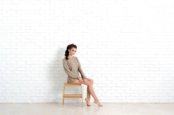 Young Beautiful Woman Sits Wooden Chair She Wearing Knitted Sweater — Stock Photo, Image