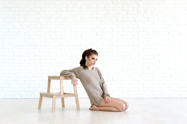 Young Beautiful Woman Sits Wooden Chair She Wearing Knitted Sweater — Stock Photo, Image