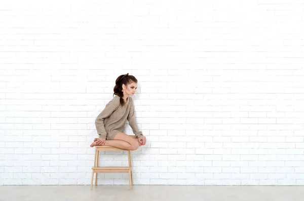 Young Beautiful Woman Sits Wooden Chair She Wearing Knitted Sweater — Stock Photo, Image