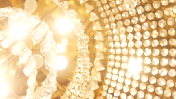 A very expensive chandelier in a chic restaurant or concert hall. Concept of luxury life. The video is suitable for the background — Stock Video