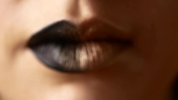 Beautiful and sexy female lips with expensive makeup. Close-up of painted female lips — Stock Video