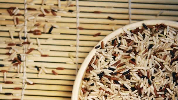 A plate with a variety of raw rice and bamboo sticks — Stock Video