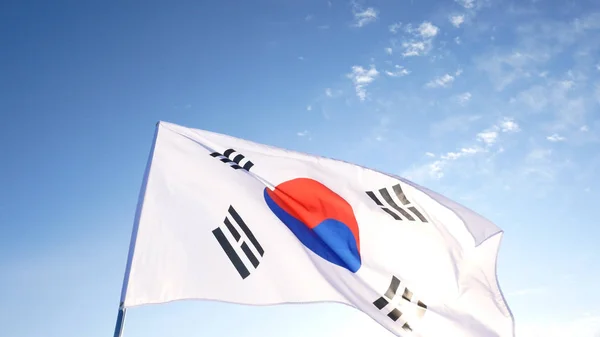 The South Korean Flag with Blue Skies