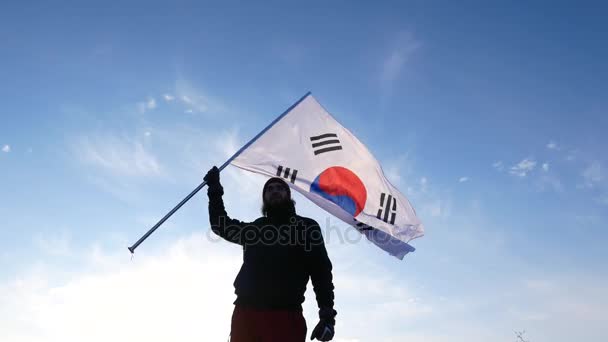 Mužské ventilátor s jihokorejské příznakem raduje a podporuje sportovce. — Stock video