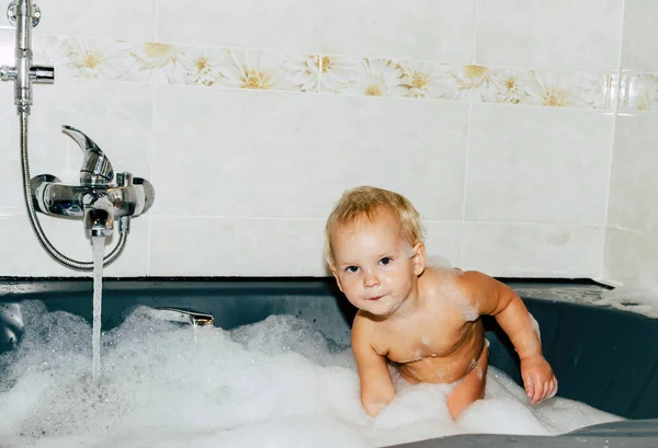 Cute baby taking a bath with foam — Stock Photo, Image