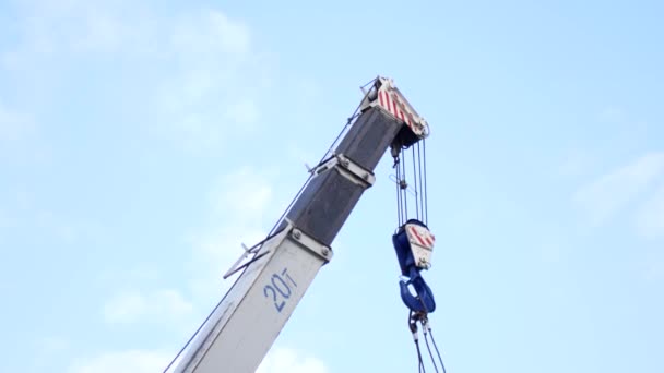 Crane against the sky at work, construction and reconstruction work — Stock Video