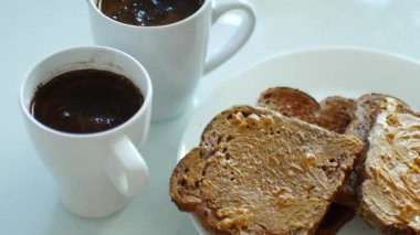 Breakfast, toast with peanut butter and coffee