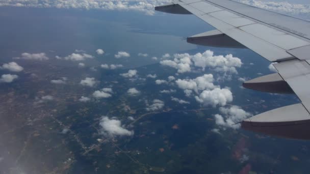 View from the airplane window on the wing and clouds. Travel to other countries. — Stock Video