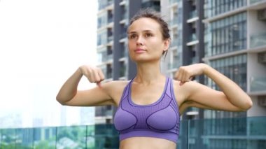 Young woman is doing joint gymnastics.