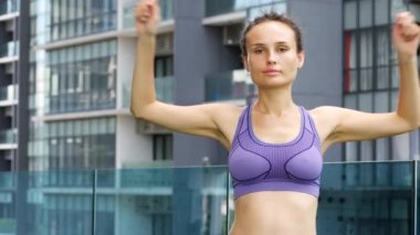 Young woman is doing joint gymnastics.
