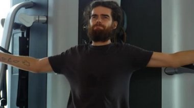 A man is training in the gym.