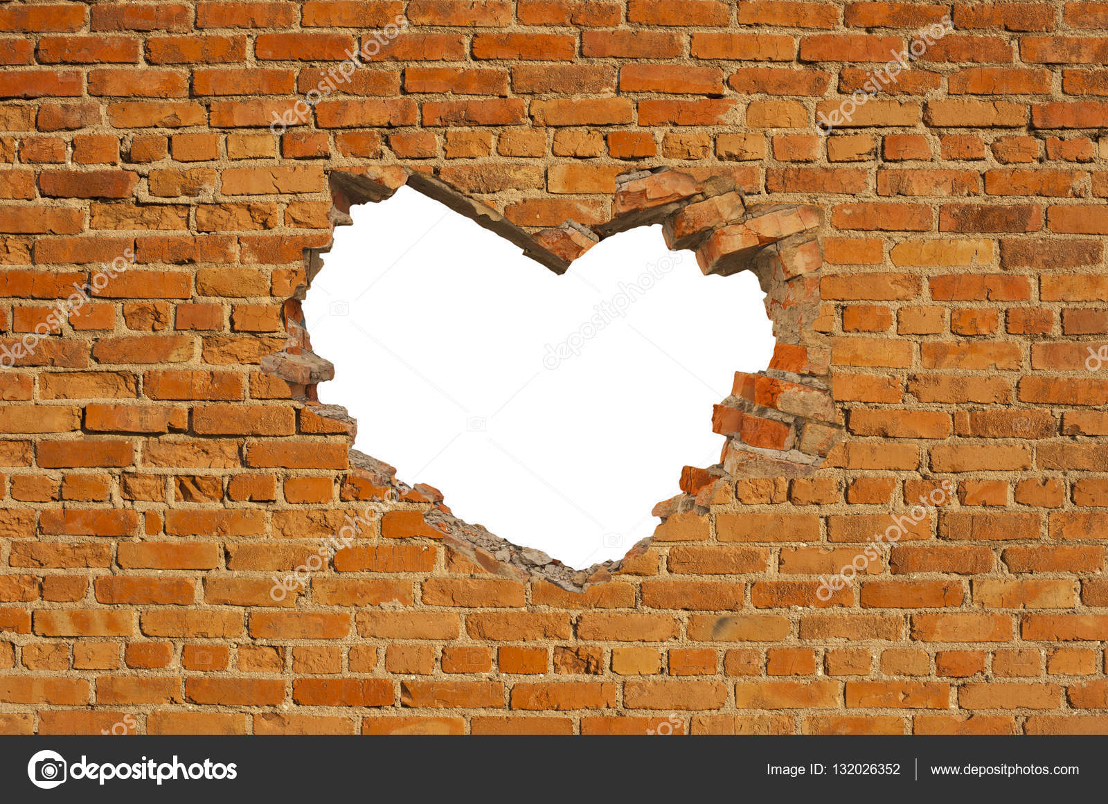 Herzförmiges Loch in alter Ziegelmauer Stockfotografie