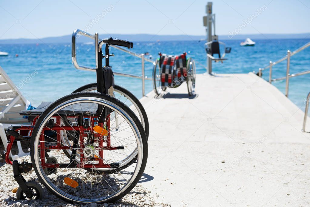 Wheelchair on the beach for handicapped people