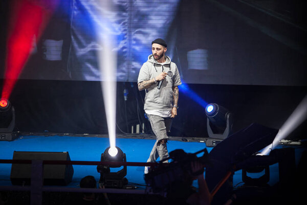MOSCOW - 18 MARCH,2016: Big professional boxing event Fight For The Future at indoor sport arena.Popular rap singer L One performing his new song 
