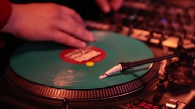 KYIV-10 OCTOBER,2019: Hip hop dj scratches vinyl records on retro analog turntables.Professional disc jockey audio equipment.Retro Vestax PDX turn table player and Ortofon Concorde spherical needle