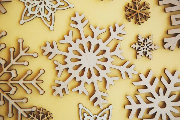 Yellow Flat Lay Holiday Background Witn Hand Made Wooden Snowflakes — 스톡 사진