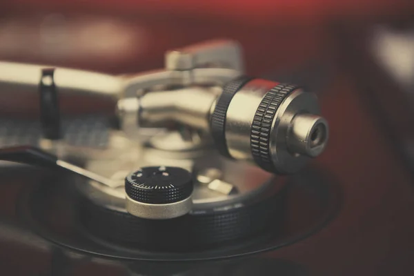 Retro turntables tonearm weights in close up.Professional disc jockey audio equipment on stage in night club.Listen to the music in hi-fi quality with vintage turn table player