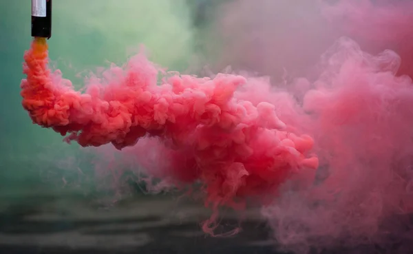 Coloroful pink smoke bombs in action — Stock Photo, Image