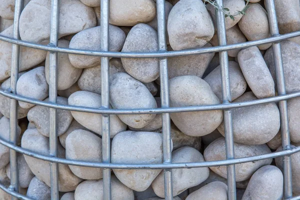 Gabion with a stone for planting ornamental plants close-up. The concept of landscape design — Stock Photo, Image