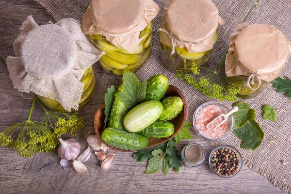 Salted cucumbers. Spices and herbs for making pickles on wooden background — Stock Photo, Image