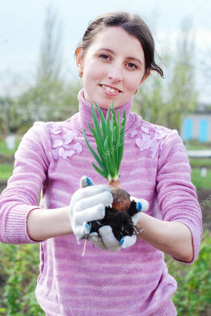 Young woman working in the garden.