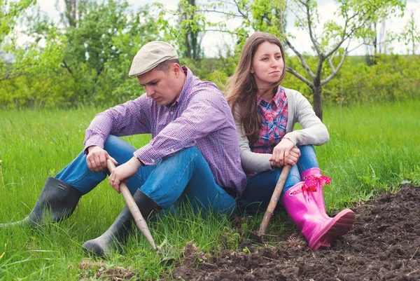 Gardeners planting greens at back yard — Stock Photo, Image