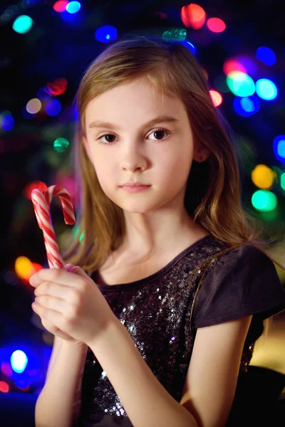 Little girl by a fireplace in a cozy room — Φωτογραφία Αρχείου