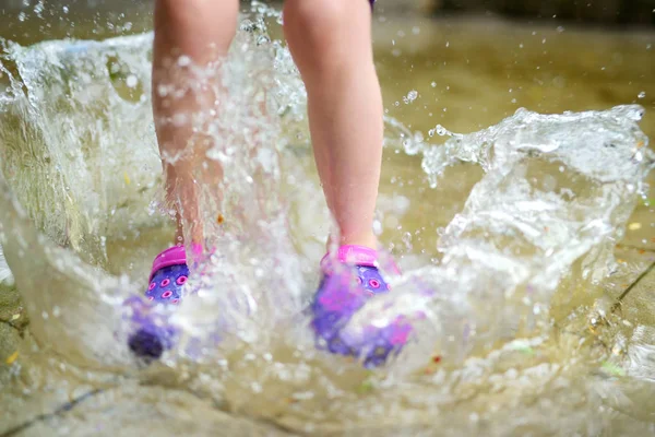 Child wearing rubber shoes — Stock Photo, Image