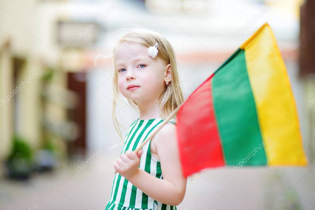 girl holding Lithuanian flag
