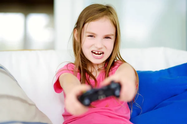 Girl playing with game console — Stock Photo, Image
