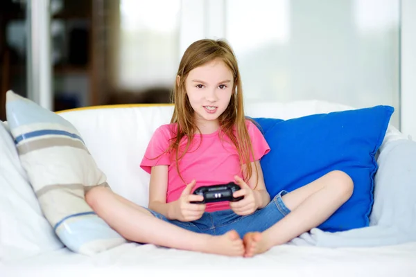 girl playing with game console