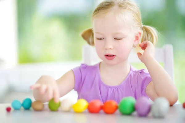 Girl having fun with colorful modeling clay — Stock Photo, Image