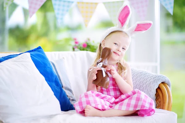 Girl with chocolate Easter rabbit — Stock Photo, Image