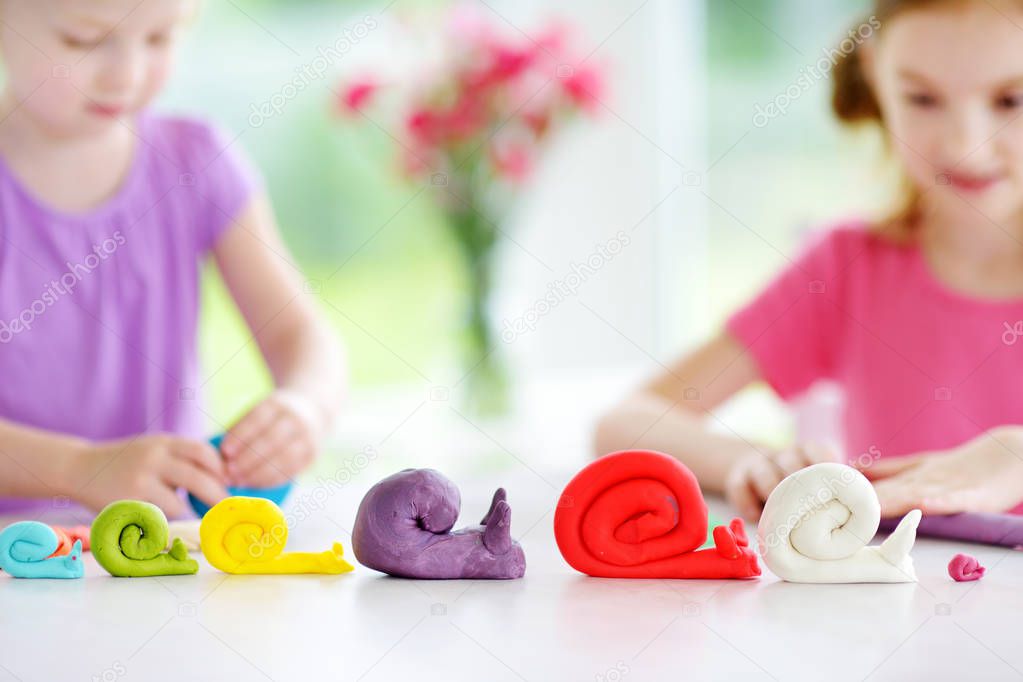 snails figures and little girls 