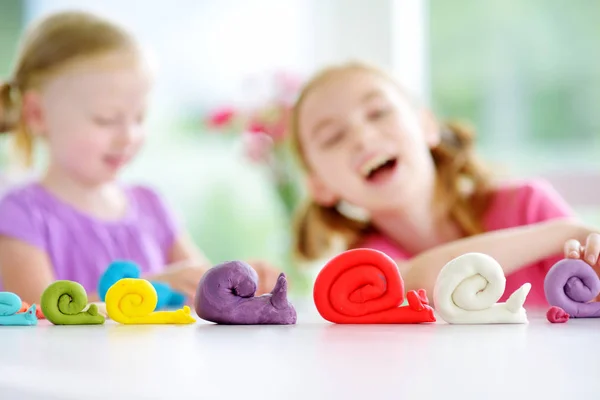 Snails figures and little girls — Stock Photo, Image