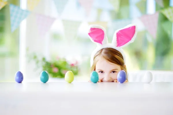 Cute little girl wearing bunny ears — Stock Photo, Image