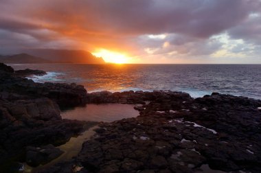 Queens Bath on island of Kauai  clipart